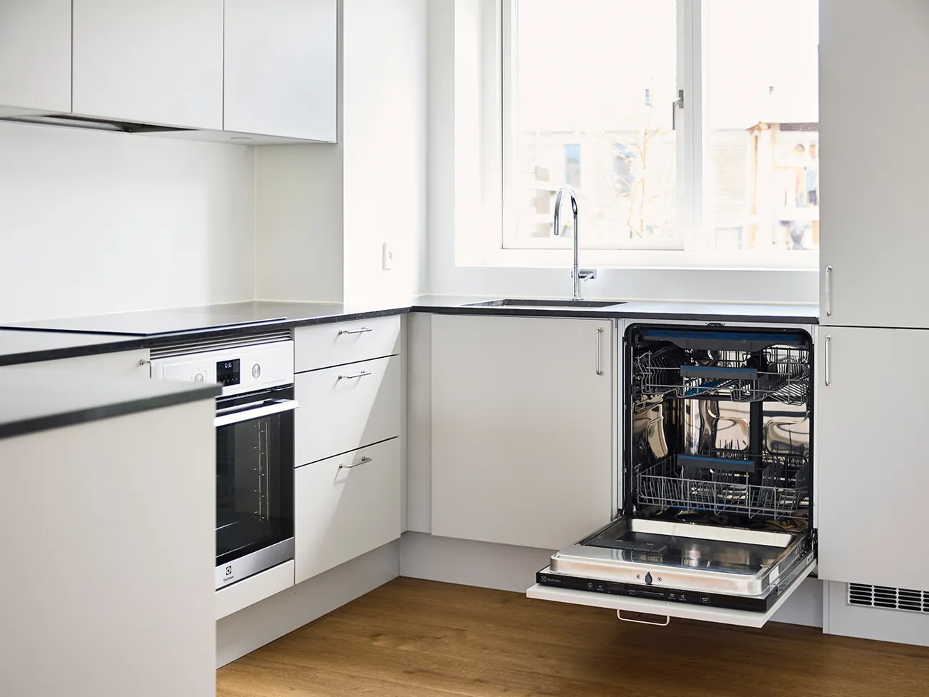 Nyistandsat køkken i plushusene med åben opvasker